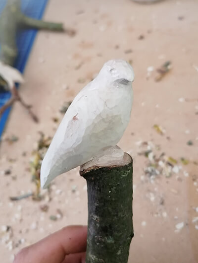Small whittled bird in the shape of a Bird of Prey.