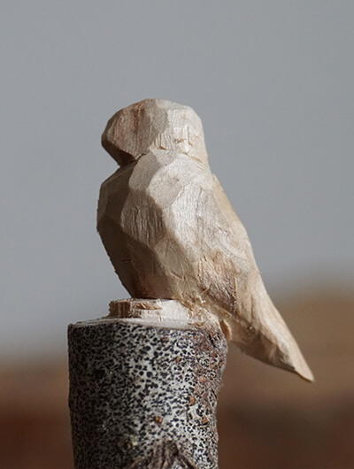 Small whittled bird in the shape of a Puffin.