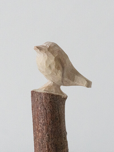Small whittled bird in the shape of a Robin.